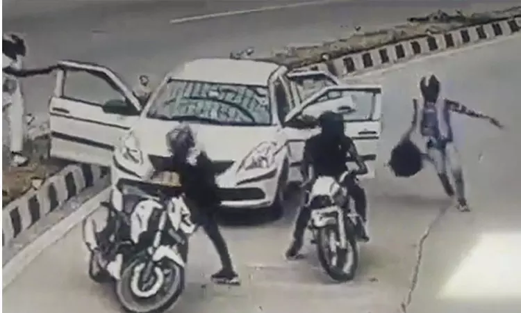 The robbery happened in broad daylight on a busy road!! The gang came on a two-wheeler by overtaking a moving car!!