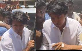 Vijay came to vote with an injured hand.